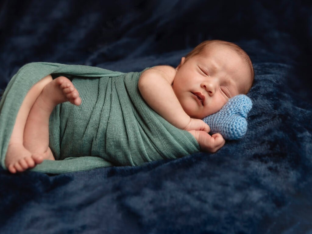 Newborn photography sessions in homes and studios throughout the Denver metro area