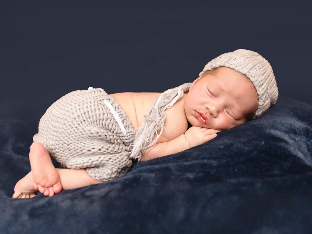 Newborn photography sessions in homes and studios throughout the Denver metro area