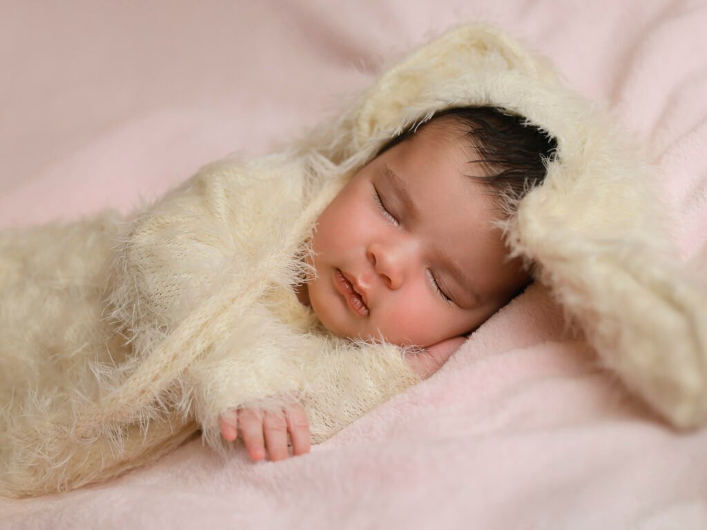 Newborn photography sessions in homes and studios throughout the Denver metro area