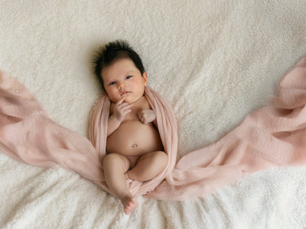 Newborn photography sessions in homes and studios throughout the Denver metro area